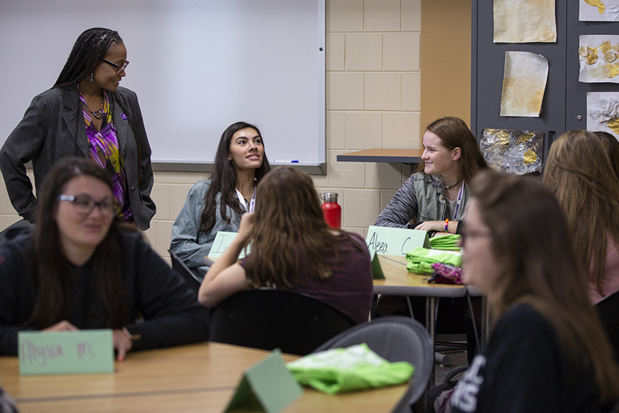 Professor Ozalle Toms get acquainted on the first day of class at Winther Hall on the UW-Whitewater campus. 