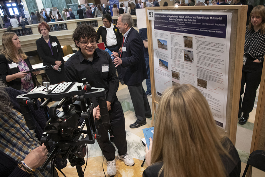 A student presents for undergraduate research at the Wisconsin State Capitol.