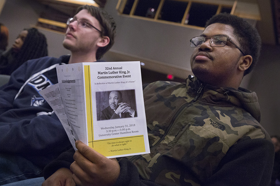 A student holds a pamphlet about Martin Luther King Jr.