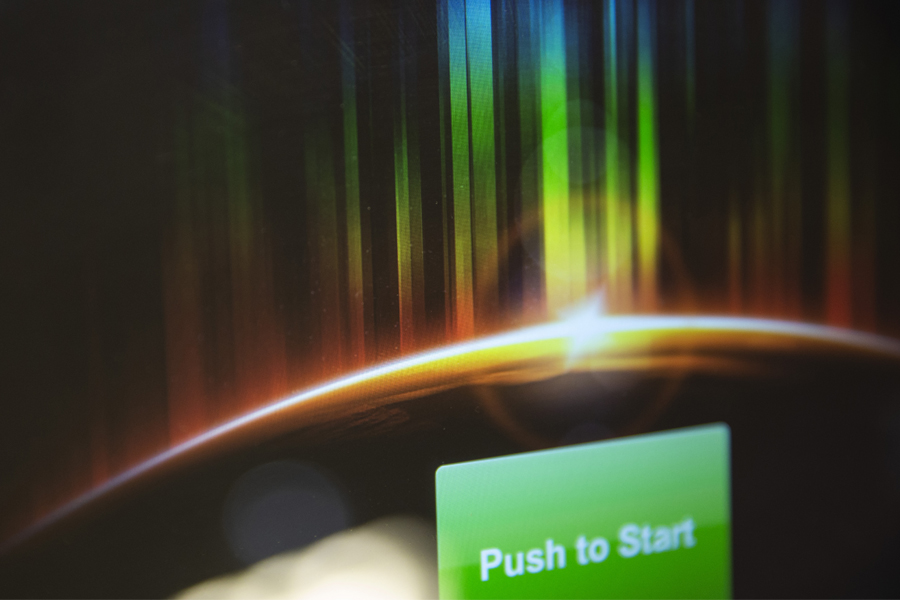 A digital rainbow and a green button that says push to start.