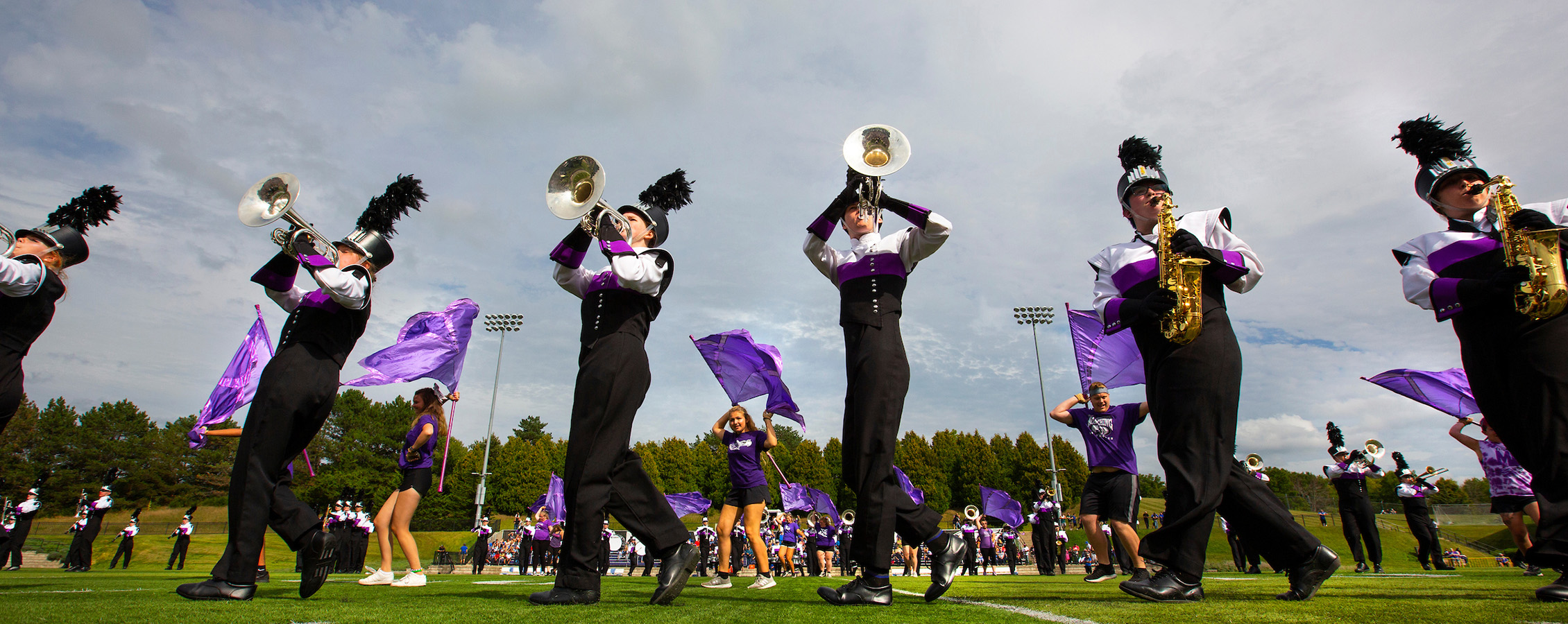 UW-Whitewater marching band members perform at a football game