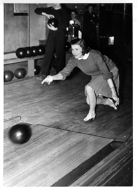 Woman bowling at Warhawk Alley