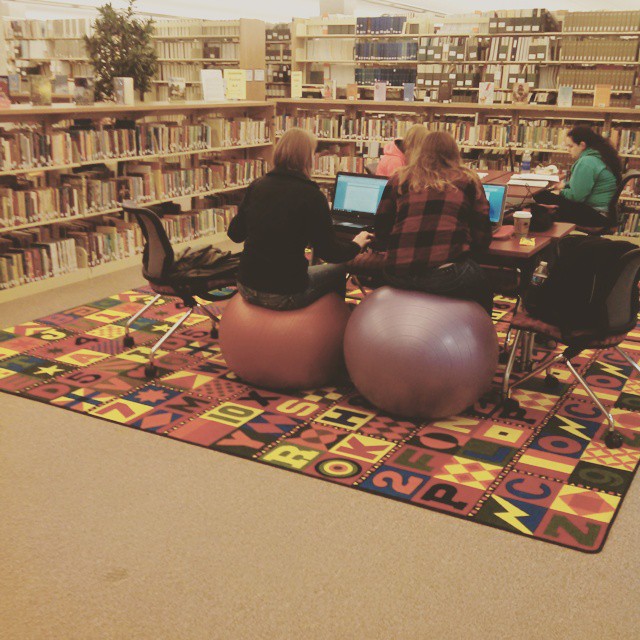 Students seated on yoga balls
