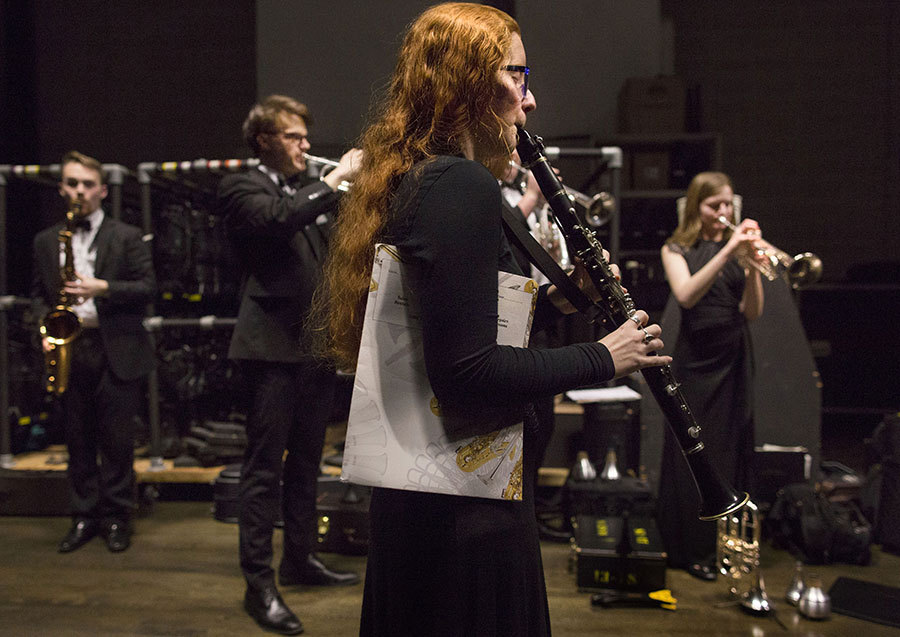 Students warm up backstage at Young Auditorium.