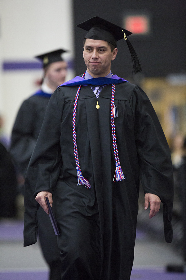 Will Funmaker, who earned a Master of Business Administration, walking at graduation