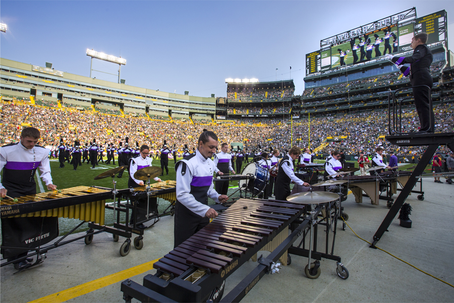 Members of the marching band line up on Lambeau Field.