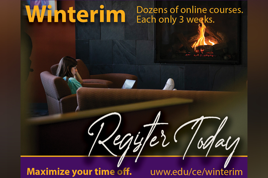 Student sitting by the fireplace in the Universiry Center