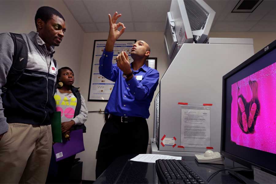 Jalal explains atomic force microscopy in a classroom of students attending a nanoscience symposium.