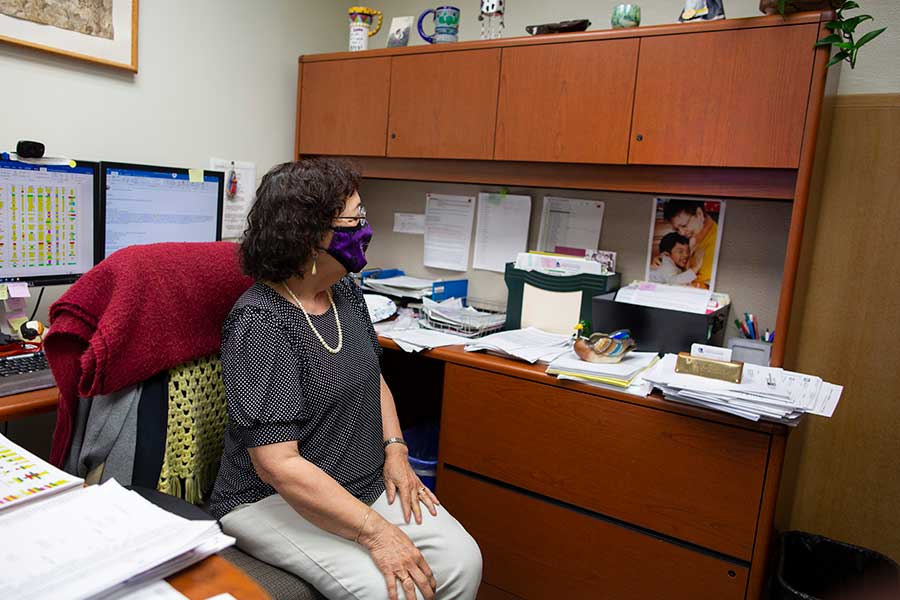 Graciela Colin-Dealca sits at her desk.