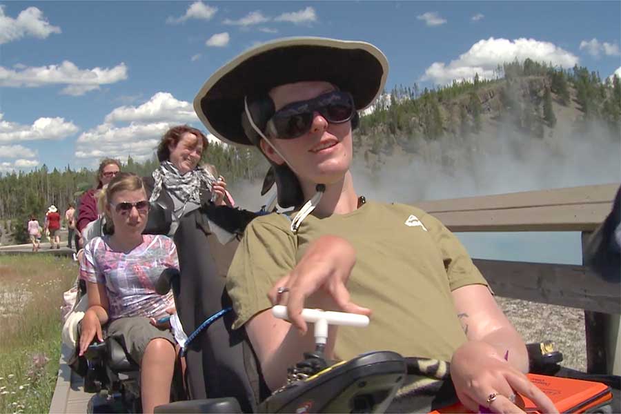 Student in wheelchair on a trail in Yellowstone National Park.