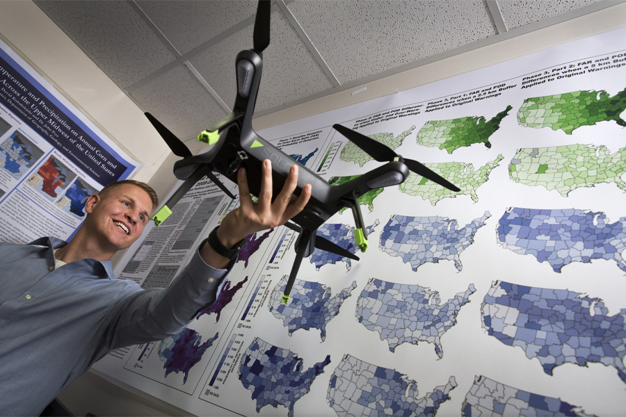 Thor Manson holds a drone.