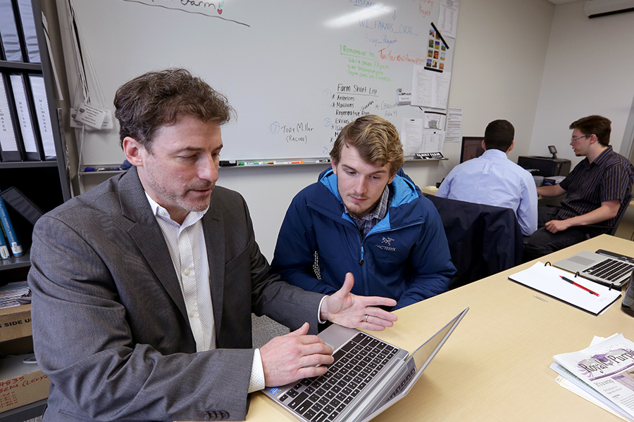 James Levy works with a student in Laurentide Hall.