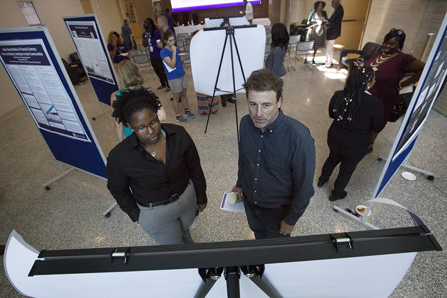 James Levy stands with a student.