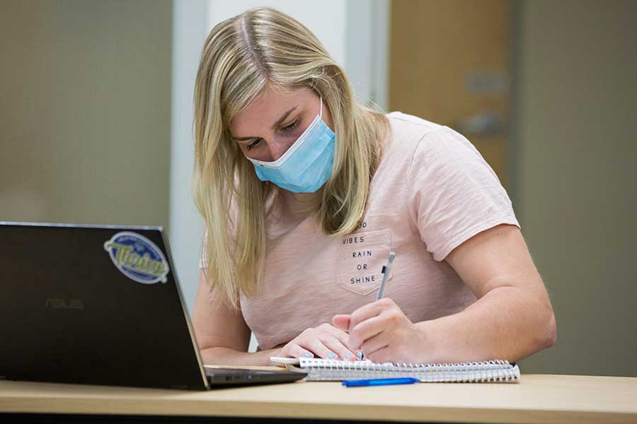 A student works in Laurentide Hall.