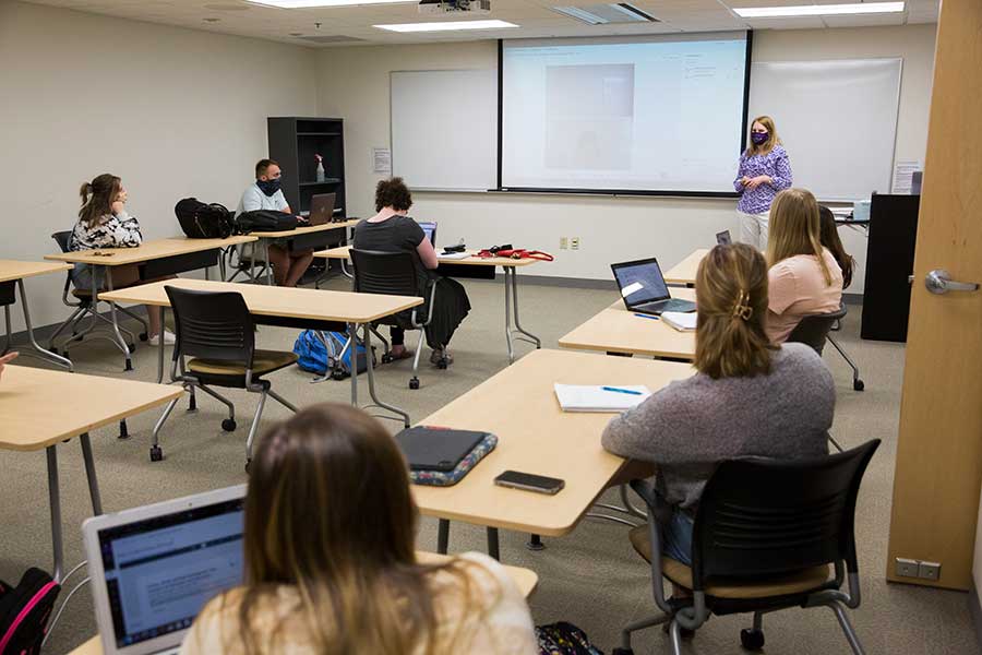 Professor of Psychology Christine Neddenriep lectures in class.