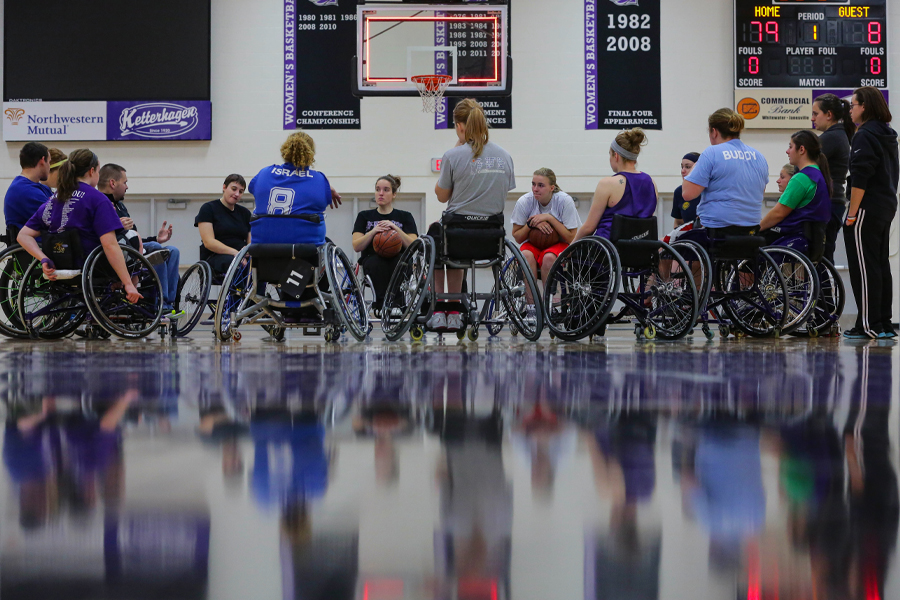 Wheelchair basketball players on the court.