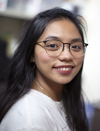 Hannah Agustin smiles at the camera.