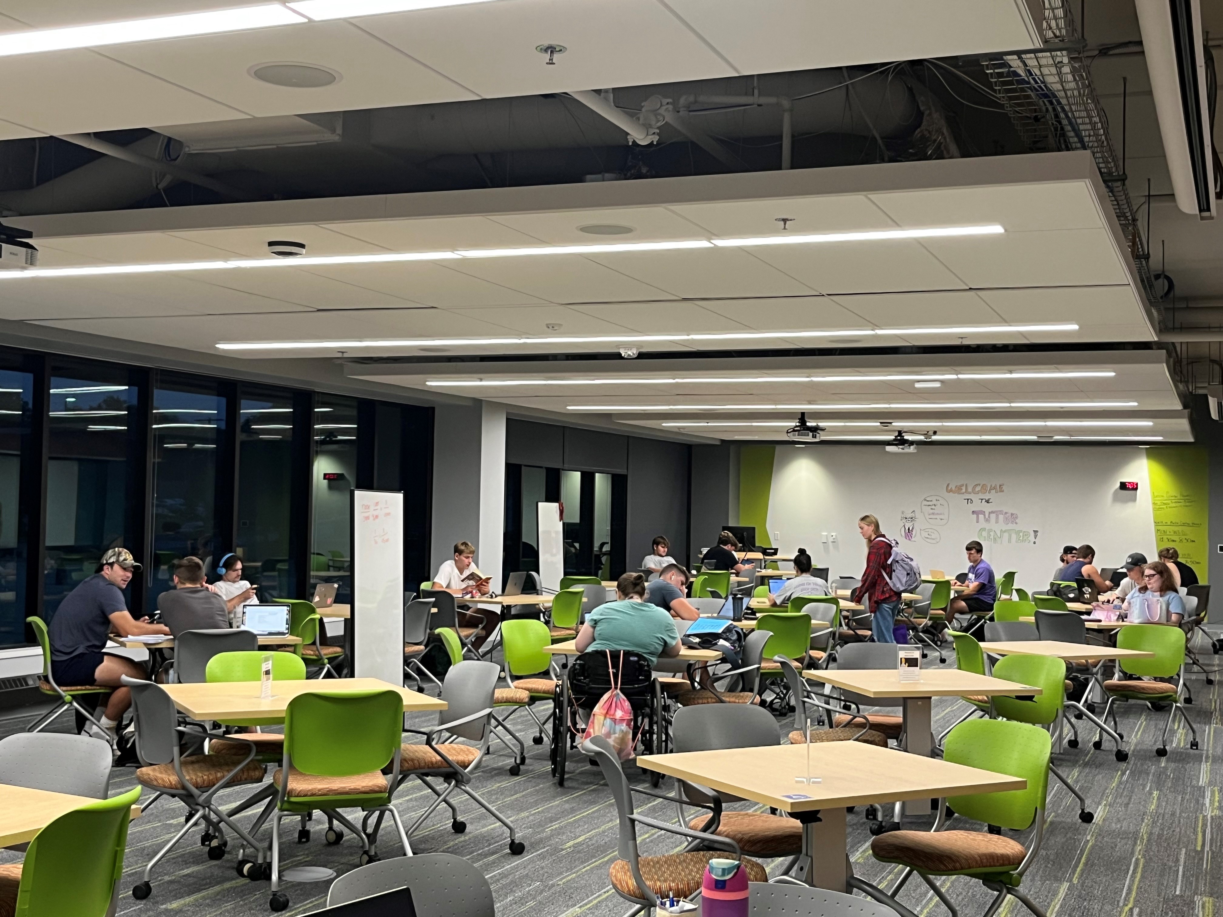The main area of the Success Center. Students study alone or in groups around small tables.
