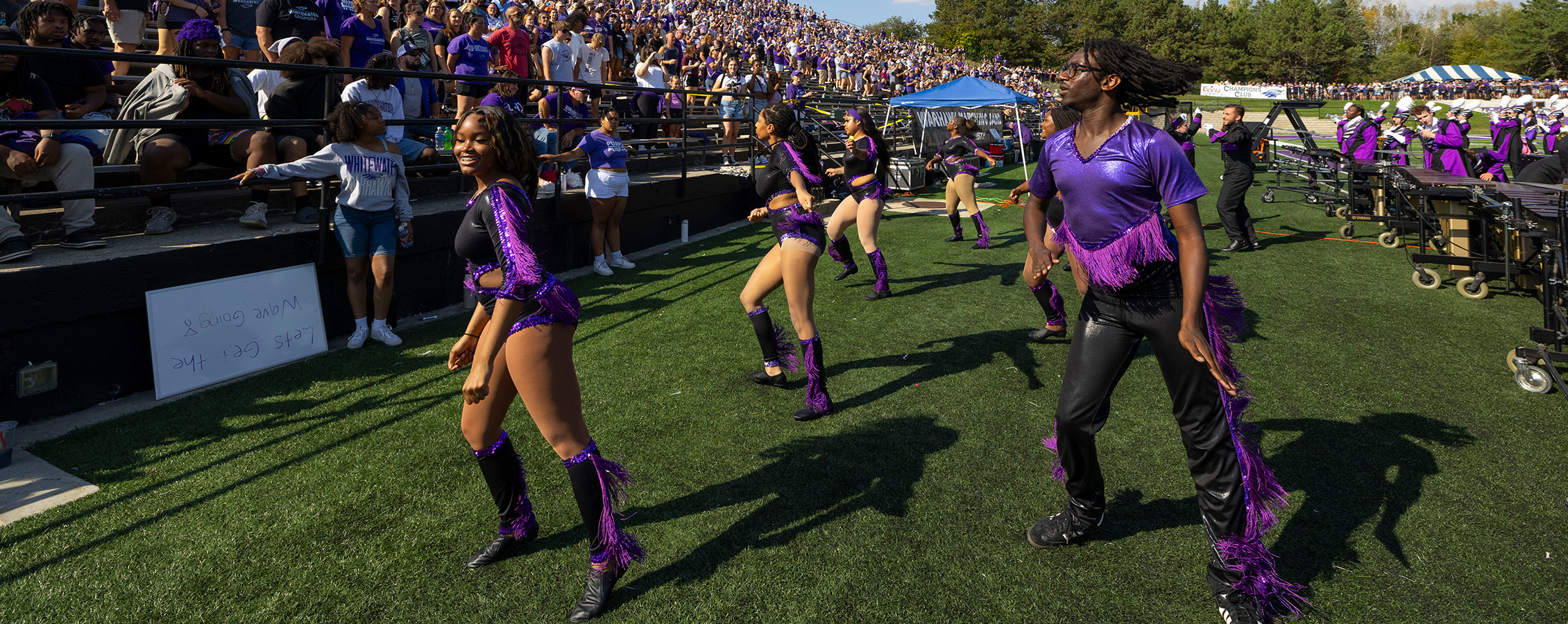 Warlettes dance on the sideline at a UW-Whitewater football game
