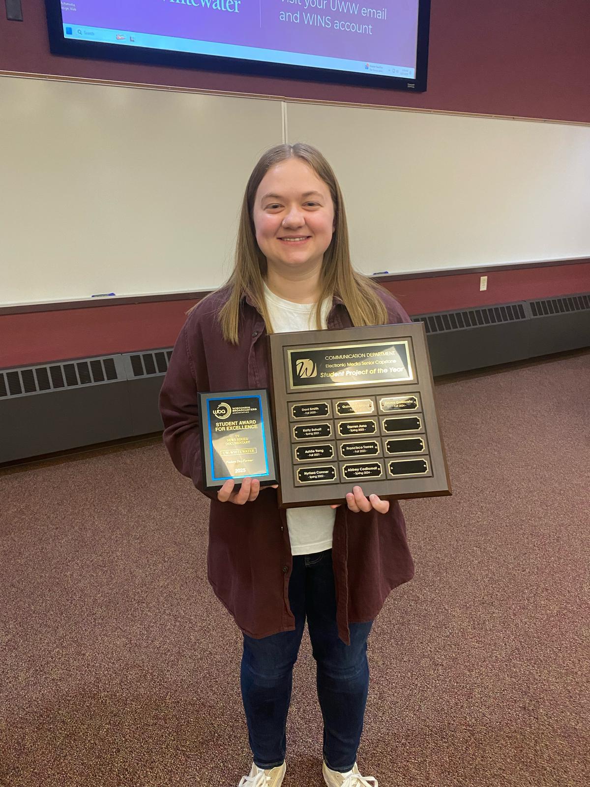Award winner with her two plaques.