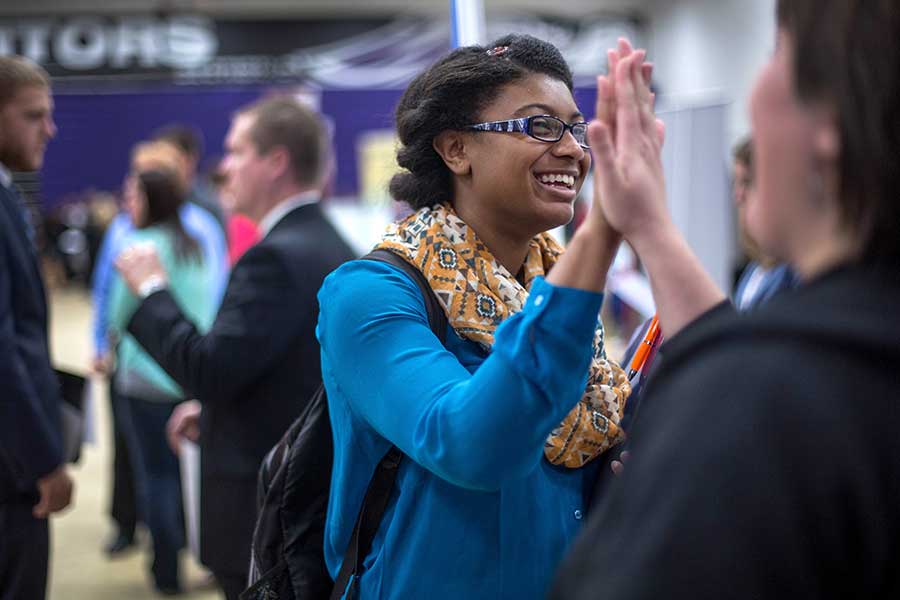 Advertising student high-fiving