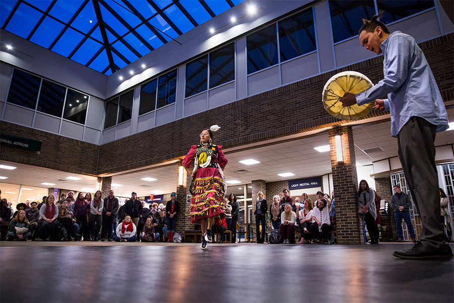 Art and design students and professors watch a performance in the Center of the Arts on the University of Wisconsin Whitewater campus.