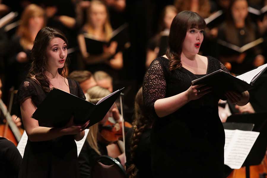 Robert Gehrenbeck and student singers from the UW-Whitewater Chamber Singers and Concert Choir receive a standing ovation.