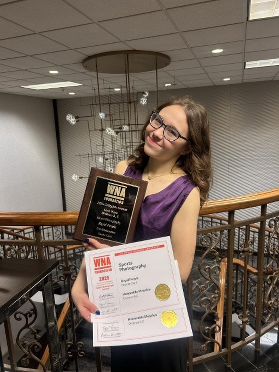 UW-Whitewater student Charlie Clark showing her awards from WNA