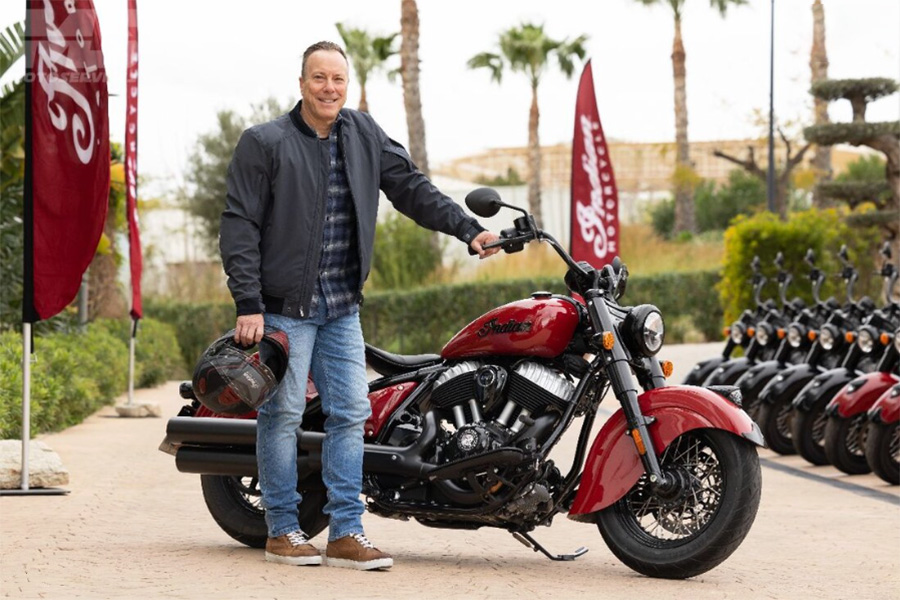 CEO of Indian Motorcycles Mike Kennedy in front of a motorcycle