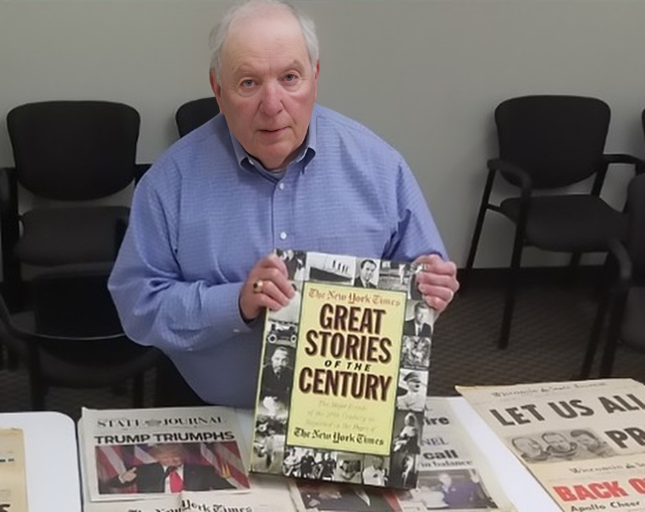 Former advisor Sam Martino holding a copy of "The New York Times Great Stories of the Century"