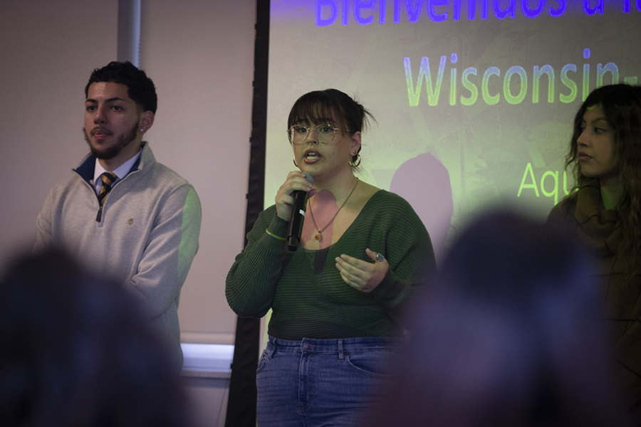 A student speaks in front of a crowd.