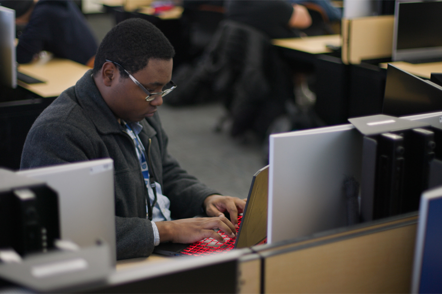 A person works in a computer in a computer lab.