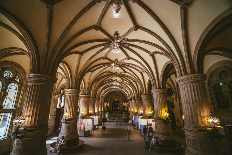 The interior of a German building with pillars and curved architecture.