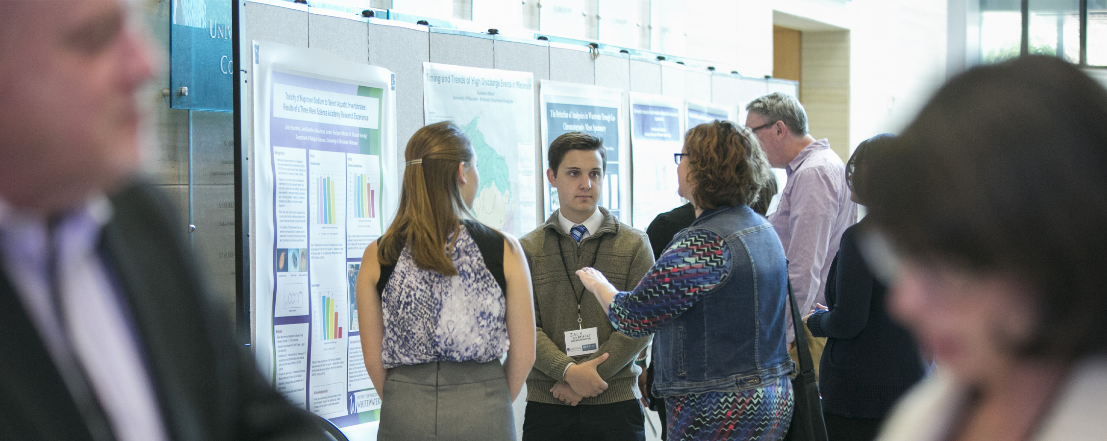 A student presents their research at a water research conference.