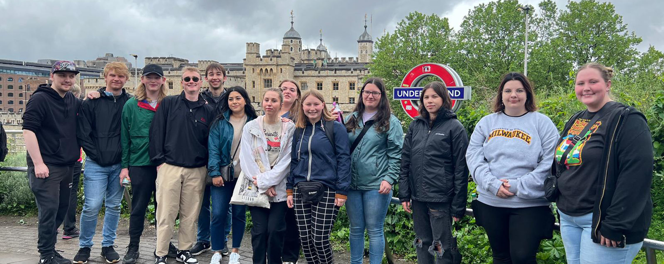 A group of students stand together outside while in Europe.