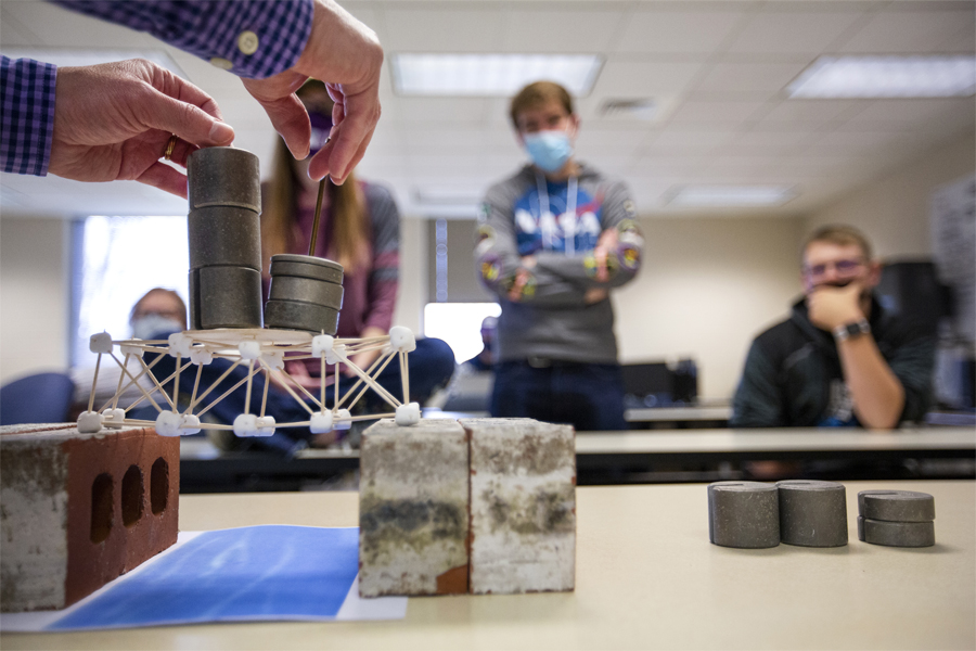 Mathematics student performing an experiment in class