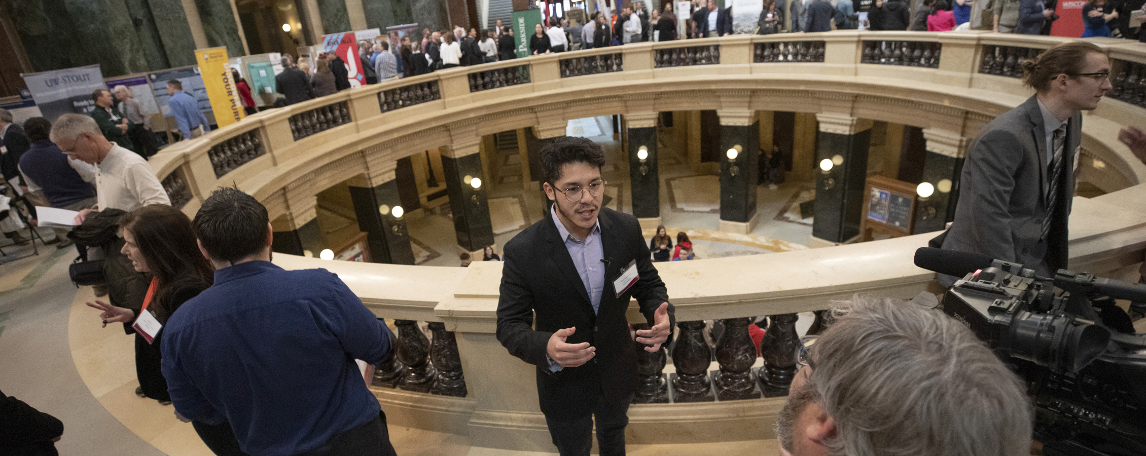 A student does an interview at the Capitol building.