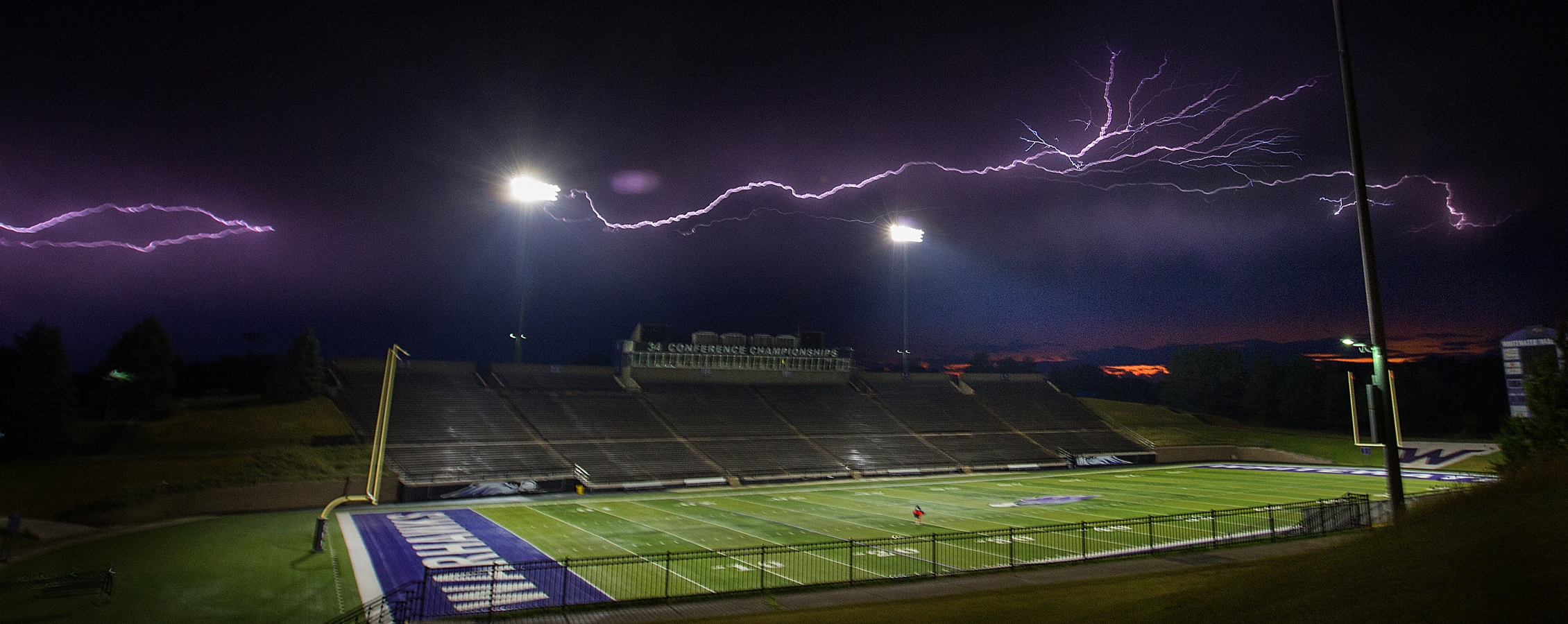 Lightning strikes against a black sky over Perkins stadium.