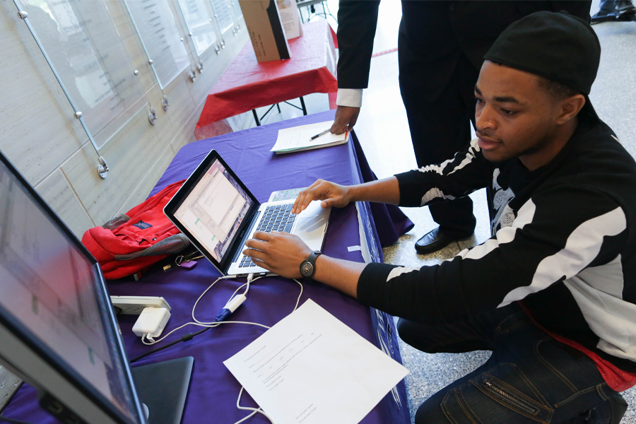 A student works on a computer.