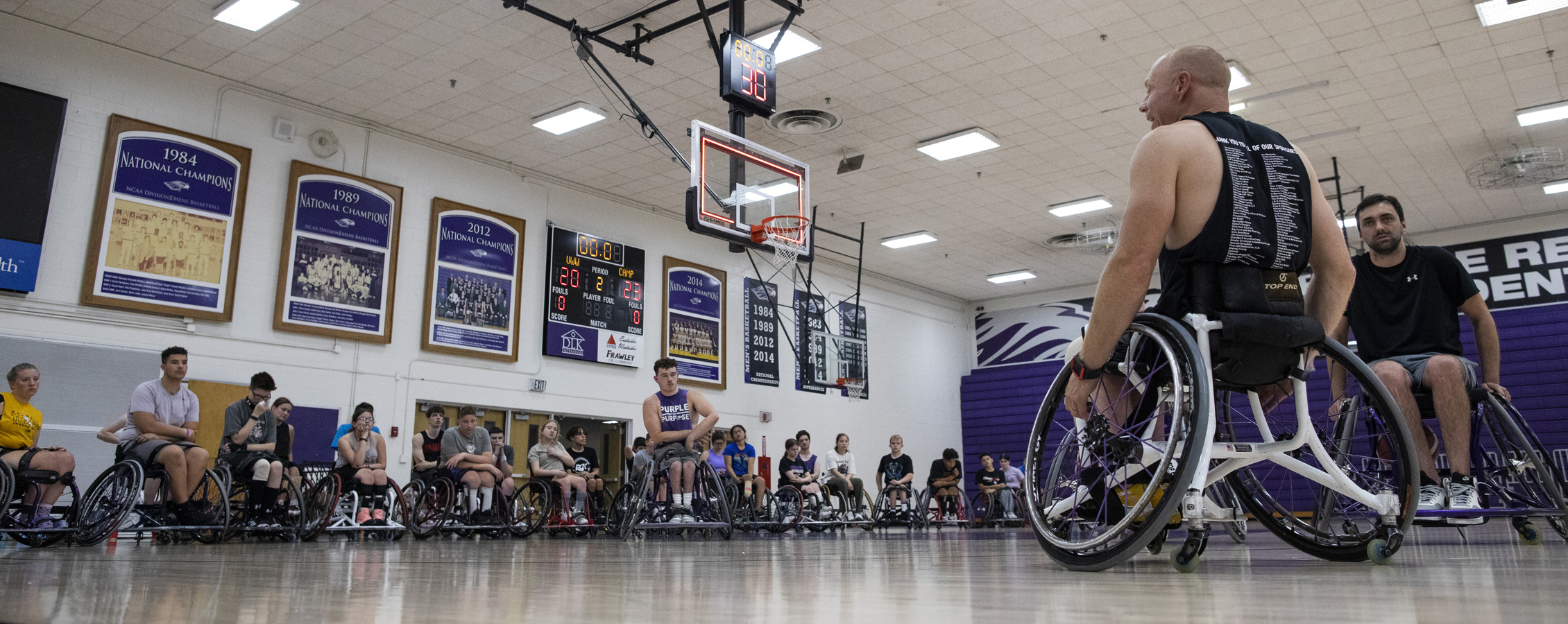 Opie Lade coaches wheelchair basketball.