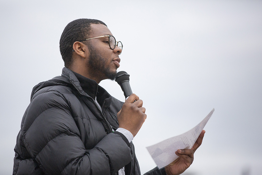 A person speaks into a microphone.