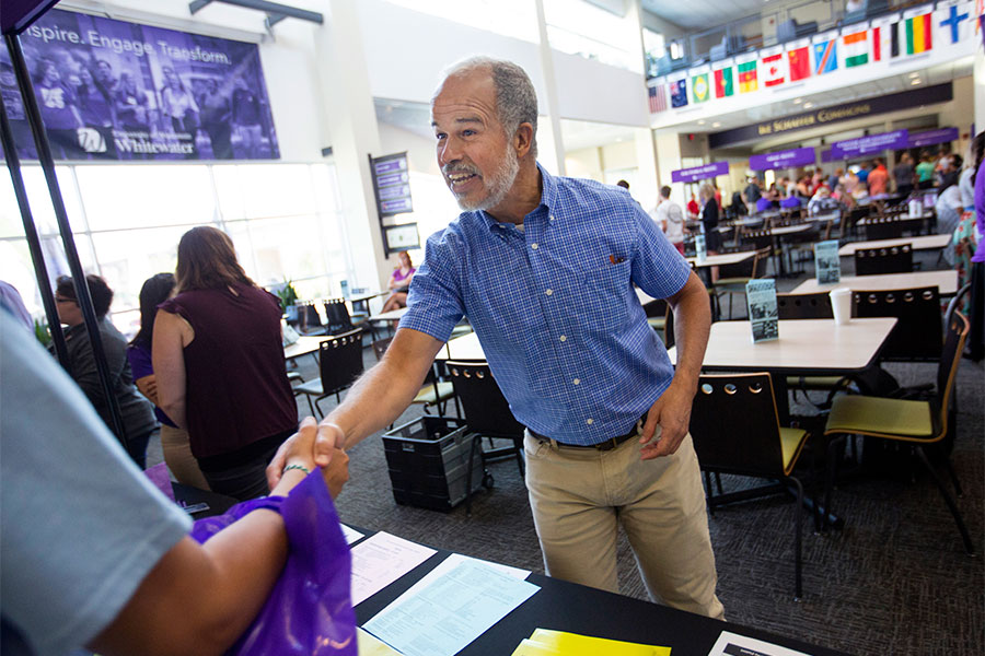  Shaking hands in the University Center on the UW-Whitewater campus.