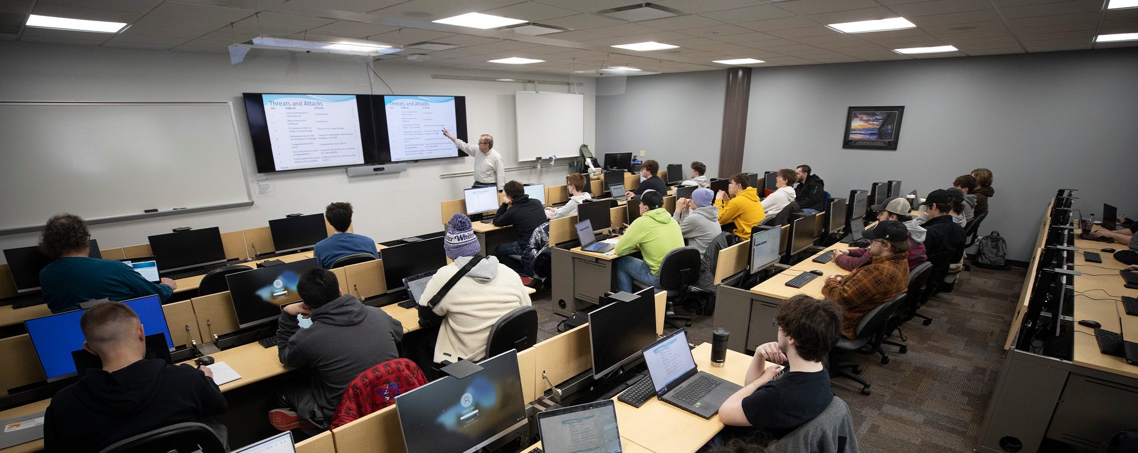 Students attend a lecture in McGraw hall.