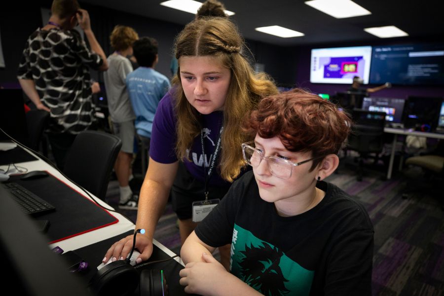 Instructor teaches campers on a computer