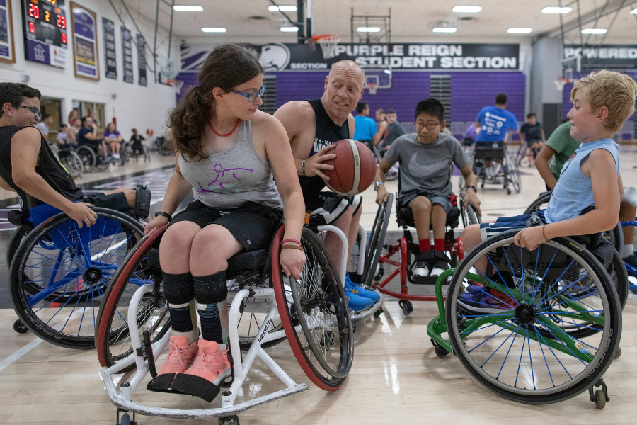 Basketball player shoots for a basket