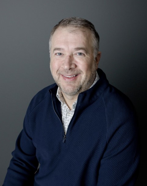 John Weiss poses for a headshot