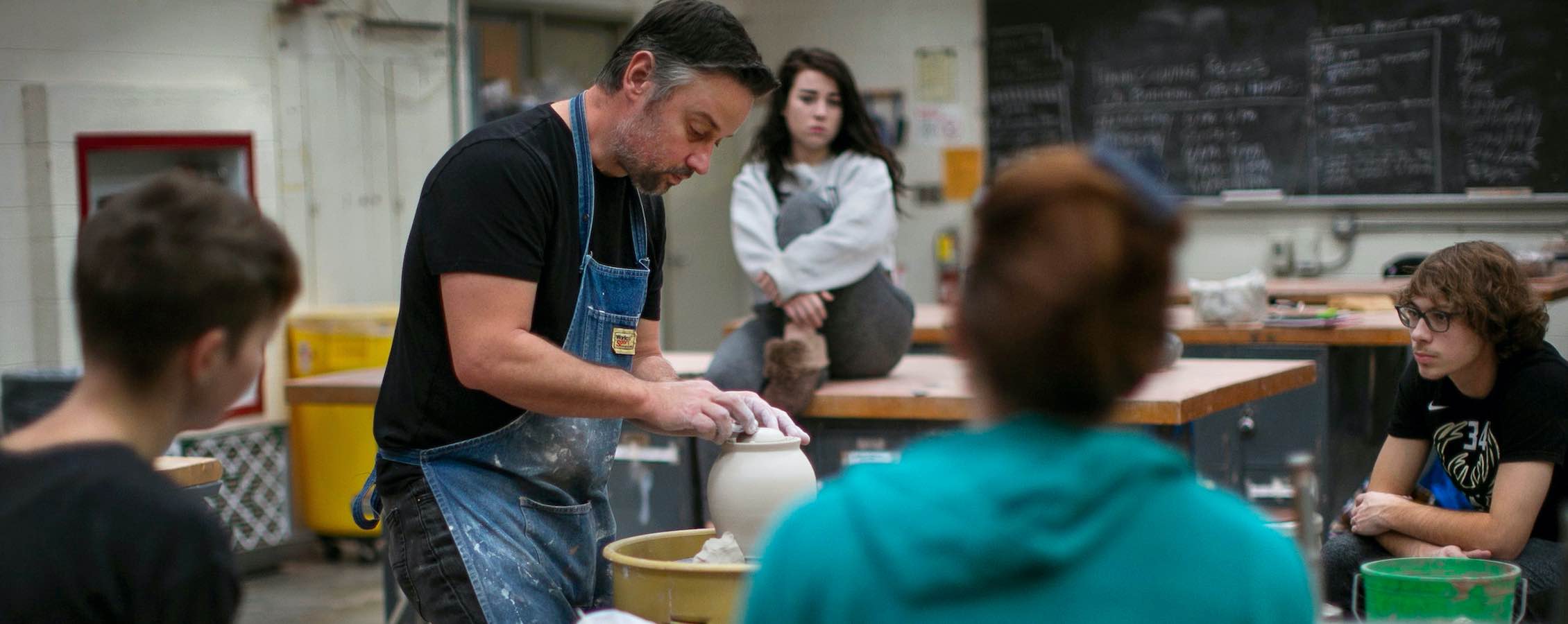 UW-Whitewater professor lectures students in ceramics class