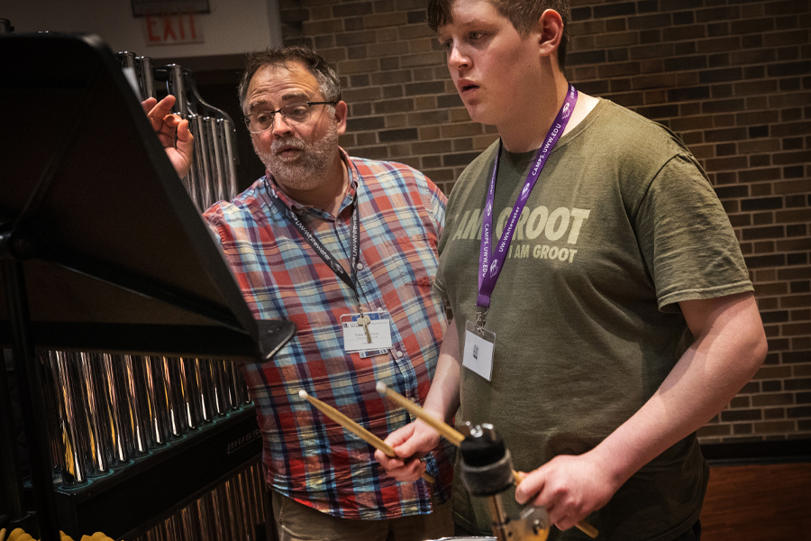 Tobie Wilkinson works with a percussion student.