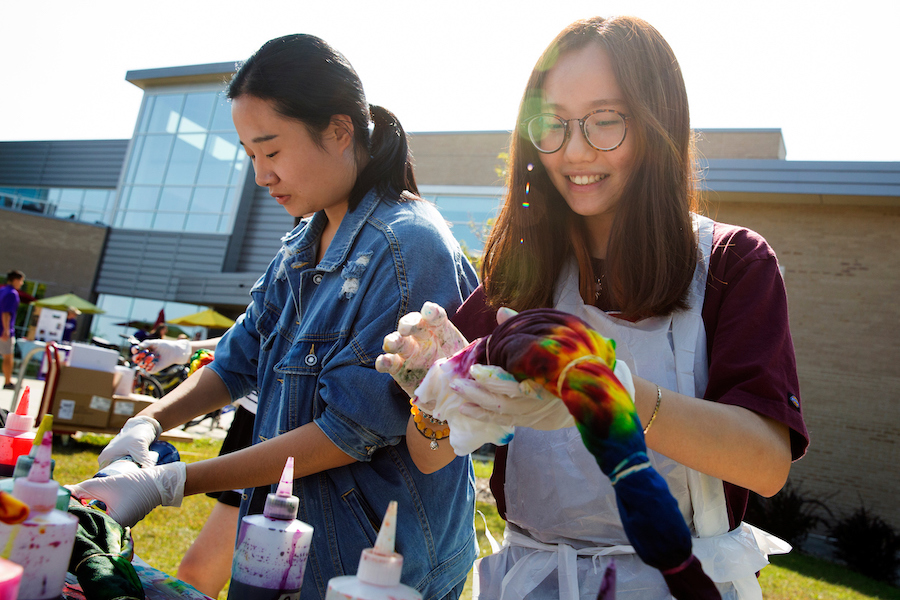 Students tie-dye shirts outside of the University Center at UW-Whitewater.