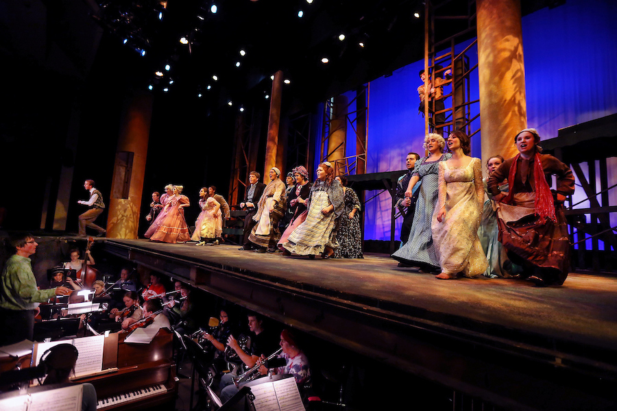 People perform on stage in the Barnett Theatre.